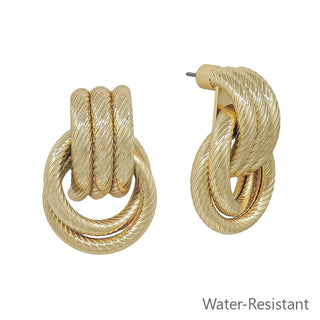 A pair of gold-tone stud earrings featuring an interlocking multi-ring knot design with a ridged rope texture, shown from front and side angles against a white background.