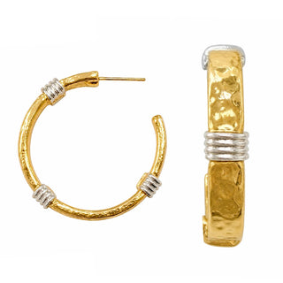 A pair of wide-band gold-tone hammered C-hoop earrings with three silver-tone coiled wire wrapping accents, shown from the front and side on a white background.